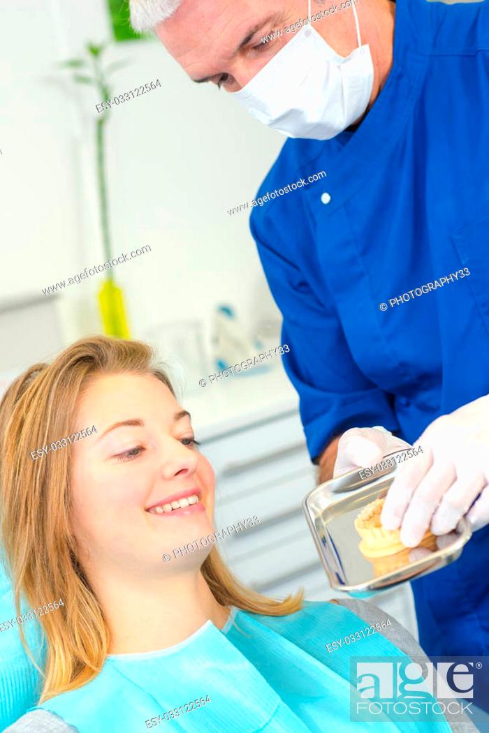 Stock Photo: Dentist with a female patient.
