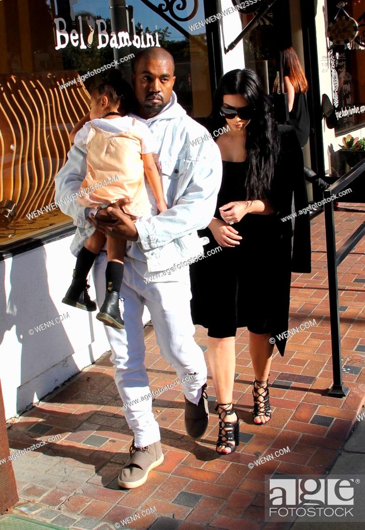 Stock Photo: Kim Kardashian and Kanye West shopping at luxury baby boutique Bel Bambini Featuring: Kim Kardashian, Kanye West, North West Where: Beverly Hills, California.