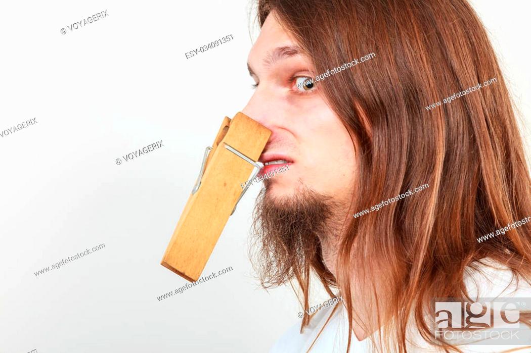 Estructuralmente Realmente natural Man with clothespin clip peg on his nose. Young long haired guy feeling  unpleasant odor stink, Foto de Stock, Imagen Low Budget Royalty Free Pic.  ESY-034091351 | agefotostock