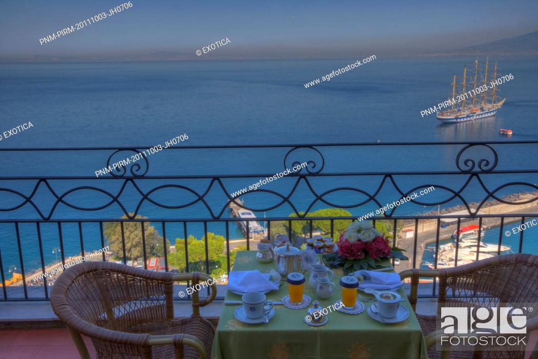 Stock Photo: Place Setting at the terrace of a hotel with the sea in the background, Sorrento, Campania, Italy.
