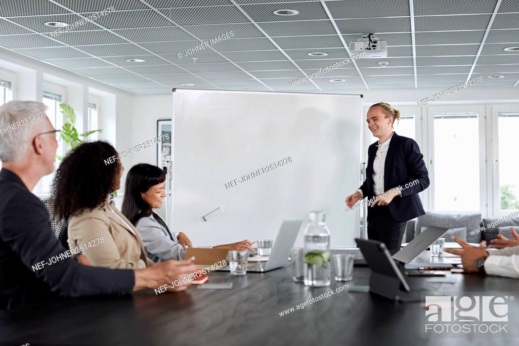 Photo de stock: Man having presentation during business meeting.