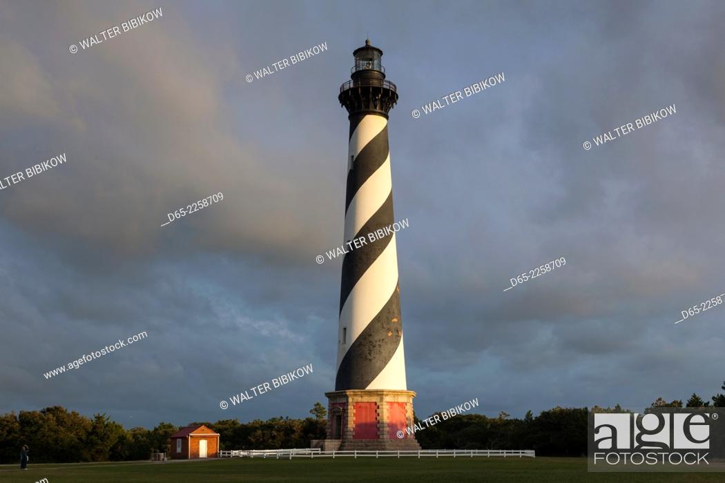 Stock Photo: USA, North Carolina, Cape Hatteras National Saeshore, Buxton, Cape Hatteras Lighthouse, b. 1870, tallest brick structure in the US, sunset.