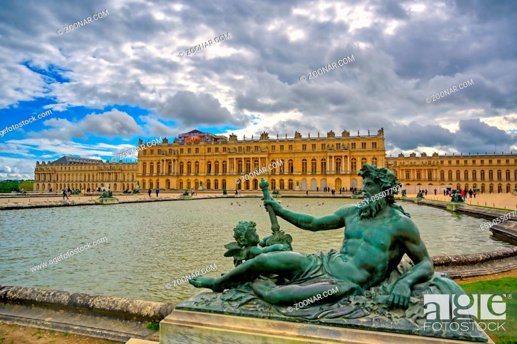 Stock Photo: Versailles, France - April 24, 2019: The statues and fountains in and around the garden of Versailles Palace on a sunny day outside of Paris, France.