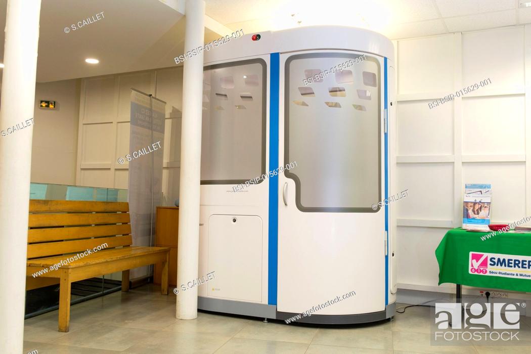 Stock Photo: E-health monitoring booth made available for students with student health cover in Paris, France. Students can have a remote check-up, guided by adapted videos.