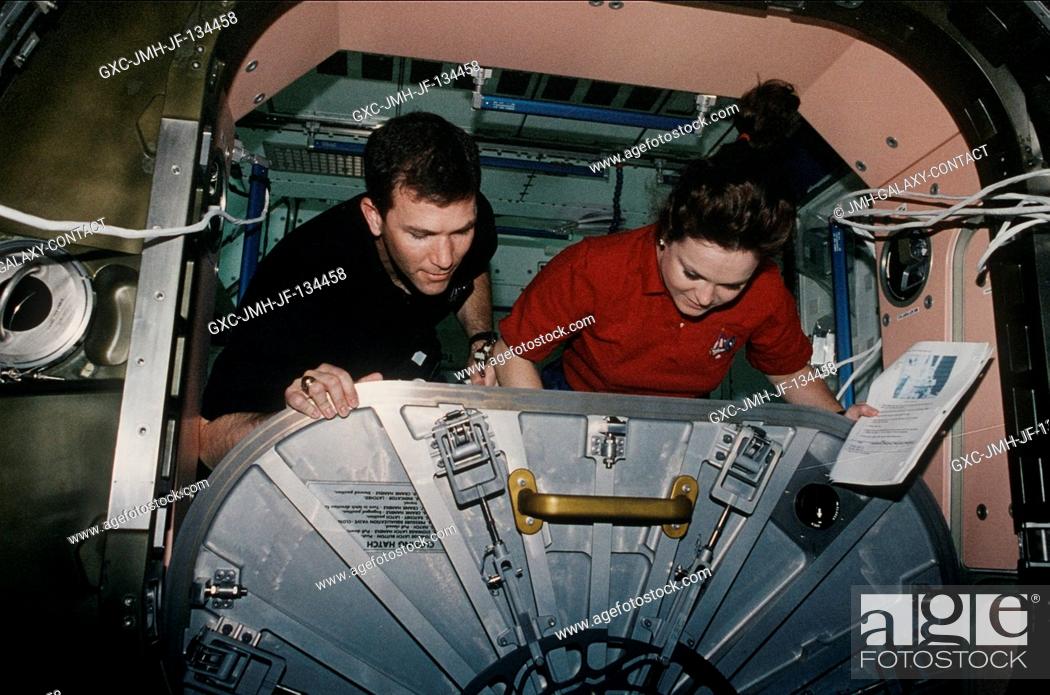 Stock Photo: Astronauts Rick D. Husband and Tamara E. Jernigan adjust the hatch for the U.S.-built Unity node. The task was part of the overall effort by the seven-member.