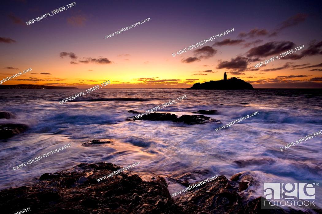 Stock Photo: High Tide at Sunset, Godrevy Point and Lighthouse, St Ives Bay, North Cornwall.