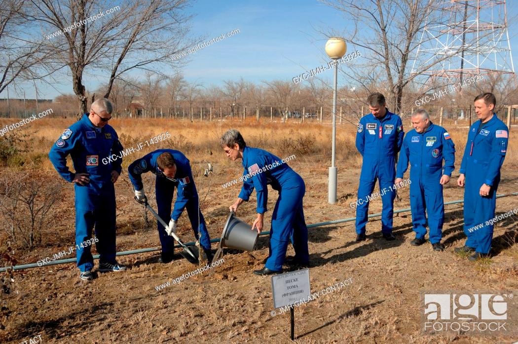 Stock Photo: At the Cosmonaut Hotel crew quarters in Baikonur, Kazakhstan, Expedition 50-51 crewmember Thomas Pesquet of the European Space Agency (second from left) plants.