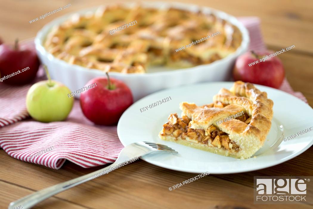 Stock Photo: close up of apple pie and fork on plate.