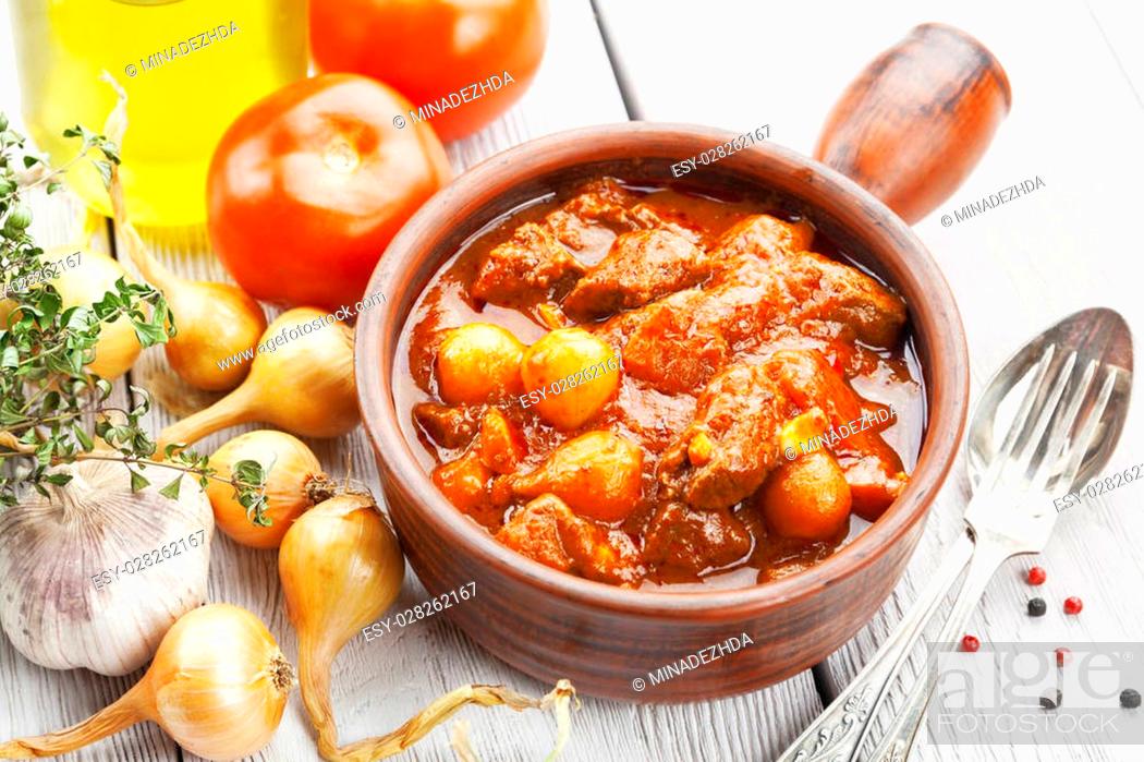 Stock Photo: Traditional Greek beef stifado on the table.