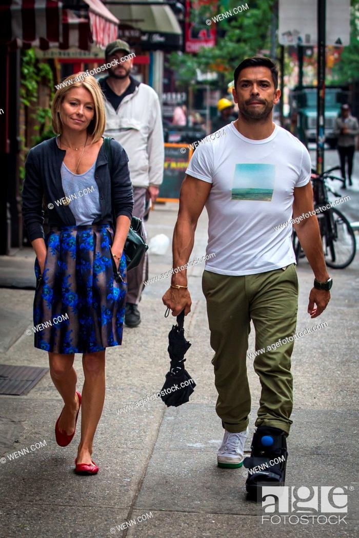 Stock Photo: Kelly Ripa and Mark Consuelos were all smiles in spite of wet weather as they were spotted strolling through SoHo Featuring: Kelly Ripa.