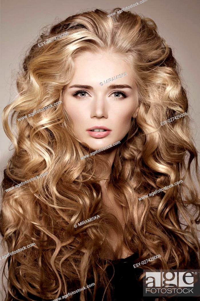 Model with blonde long hair. Waves Curls Hairstyle. Hair Salon. Updo, Stock  Photo, Picture And Low Budget Royalty Free Image. Pic. ESY-027429006 |  agefotostock