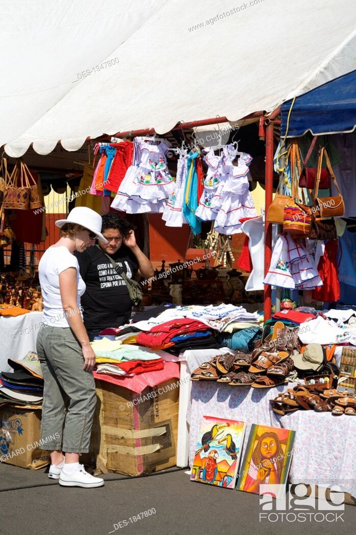 Stock Photo: Puerto Corinto, Chinandega, Nicaragua, Central America, Shopper in outdoor craft market.