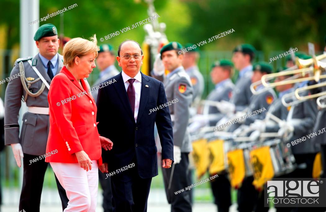 Stock Photo: German Chancellor Angela Merkel welcomes Burmese President Thein Sein with military honours at the Federal Chancellery in Berlin, Germany, 03 September 2014.