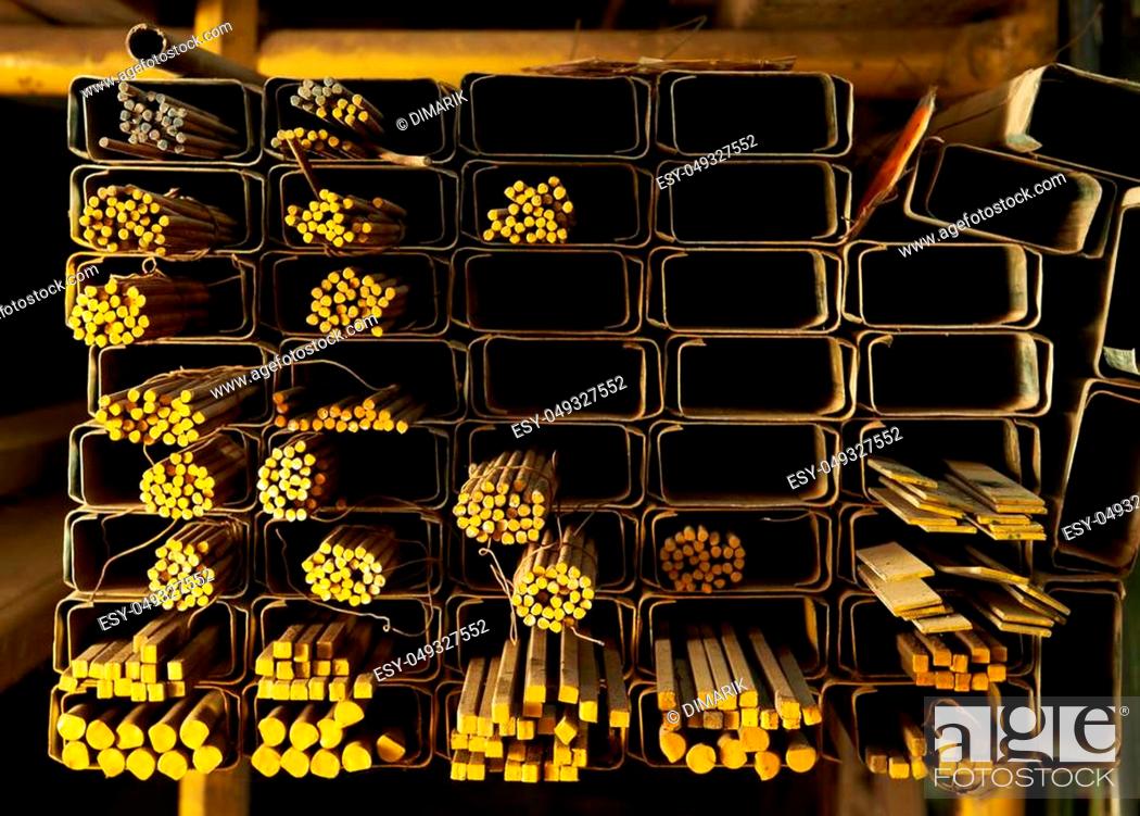 Stock Photo: close up of metal rods for construction in warehouse.