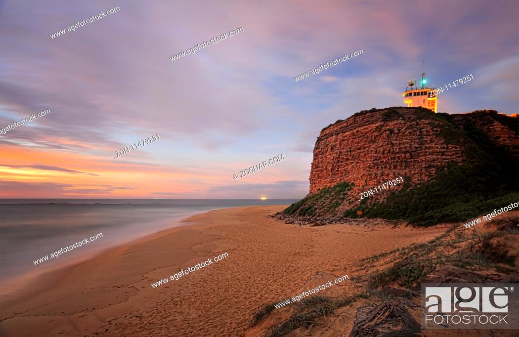 Stock Photo: Nobbys Lighthouse Newcastle - a beacon of light for ships into the oldest and one of the largest tonnage ports. It was built in 1858.