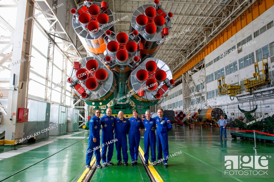 Stock Photo: At the Baikonur Cosmodrome in Kazakhstan, the Expedition 53-54 prime and backup crewmembers pose for pictures Sept. 7 in front of the first stage engines of the.