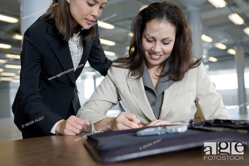 Stock Photo: Business colleagues working in office.