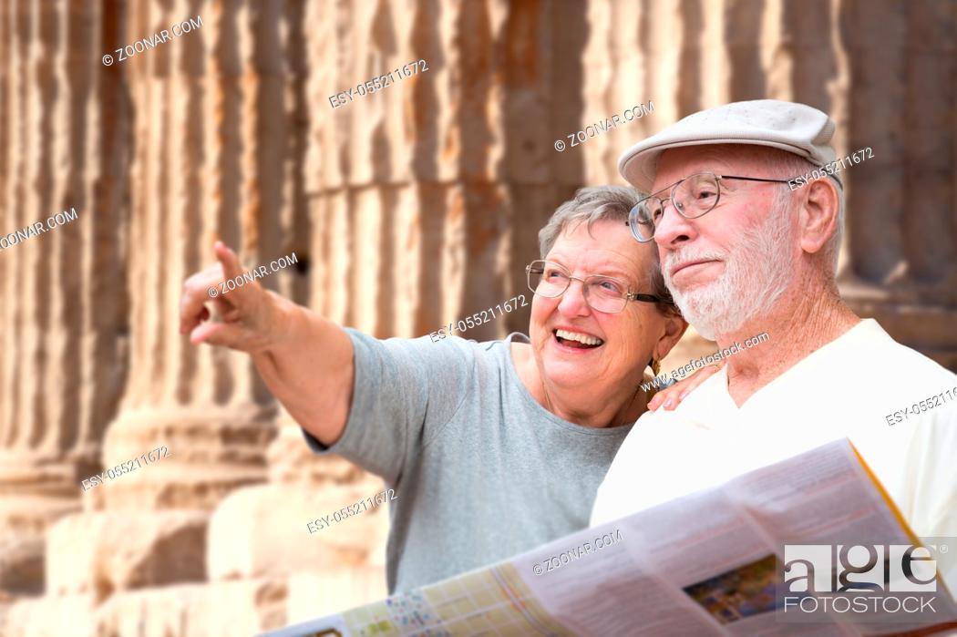 Stock Photo: Happy Senior Adult Couple Tourists with Brochure Next To Ancient Column Ruins.