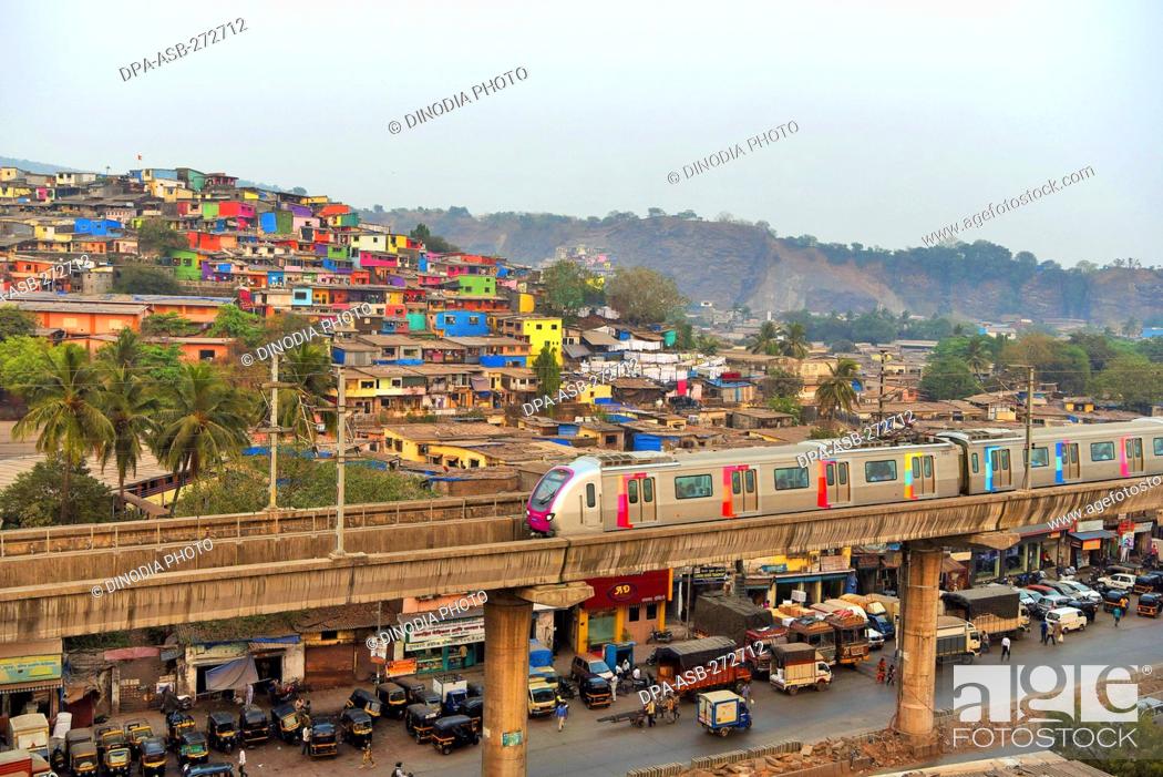 Photo de stock: Metro train near Asalpha railway station, Mumbai, Maharashtra, India, Asia.
