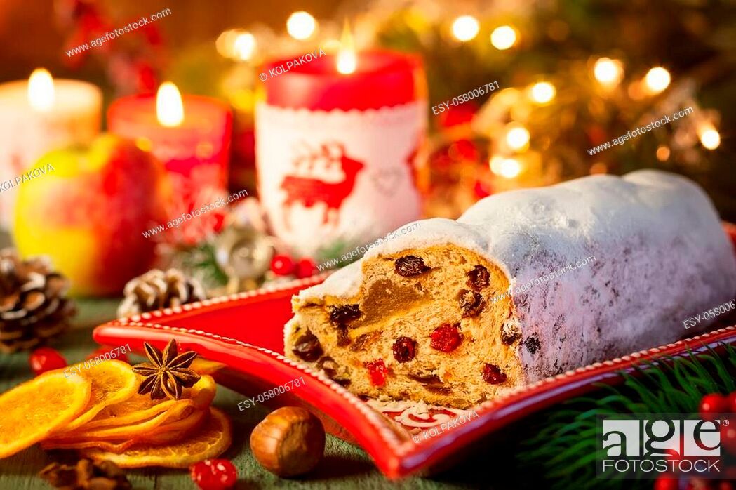 Stock Photo: Traditional Christmas cake Stollen with marzipan, dried fruit and icing sugar.