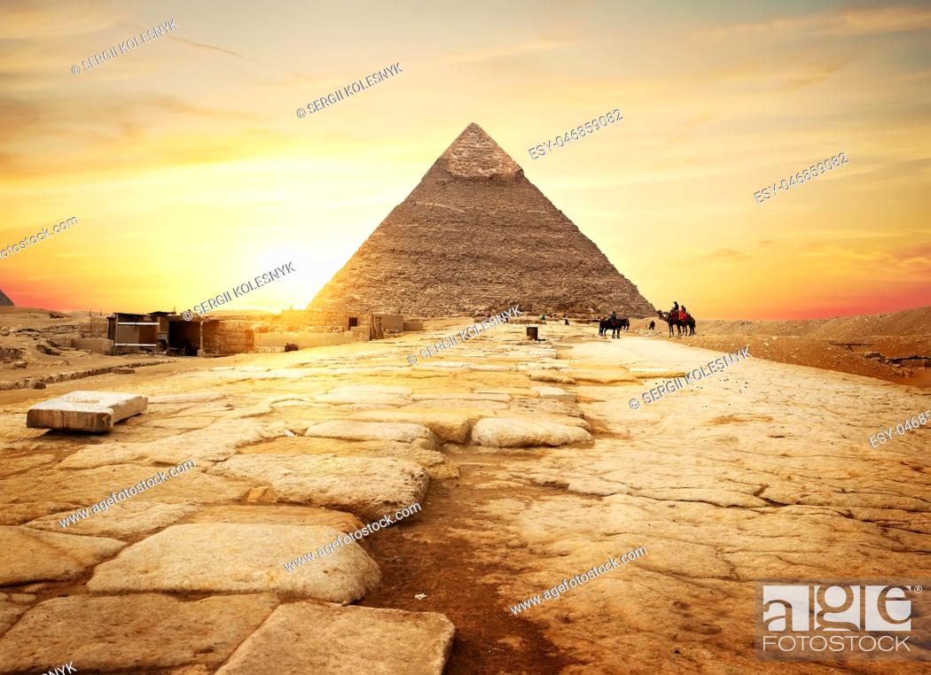 Photo de stock: Egyptian pyramid in sand desert and clear sky.