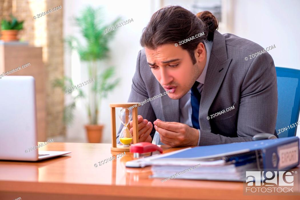 Stock Photo: Male employee in time management concept.