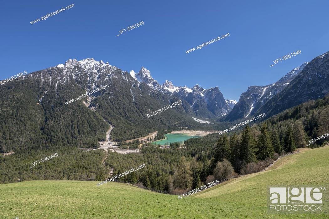 Stock Photo: Dobbiaco/Toblach, Dolomites, South Tyrol, Italy. The lake Dobbiaco with the peaks of Croda dei Baranci and Croda Bagnata.
