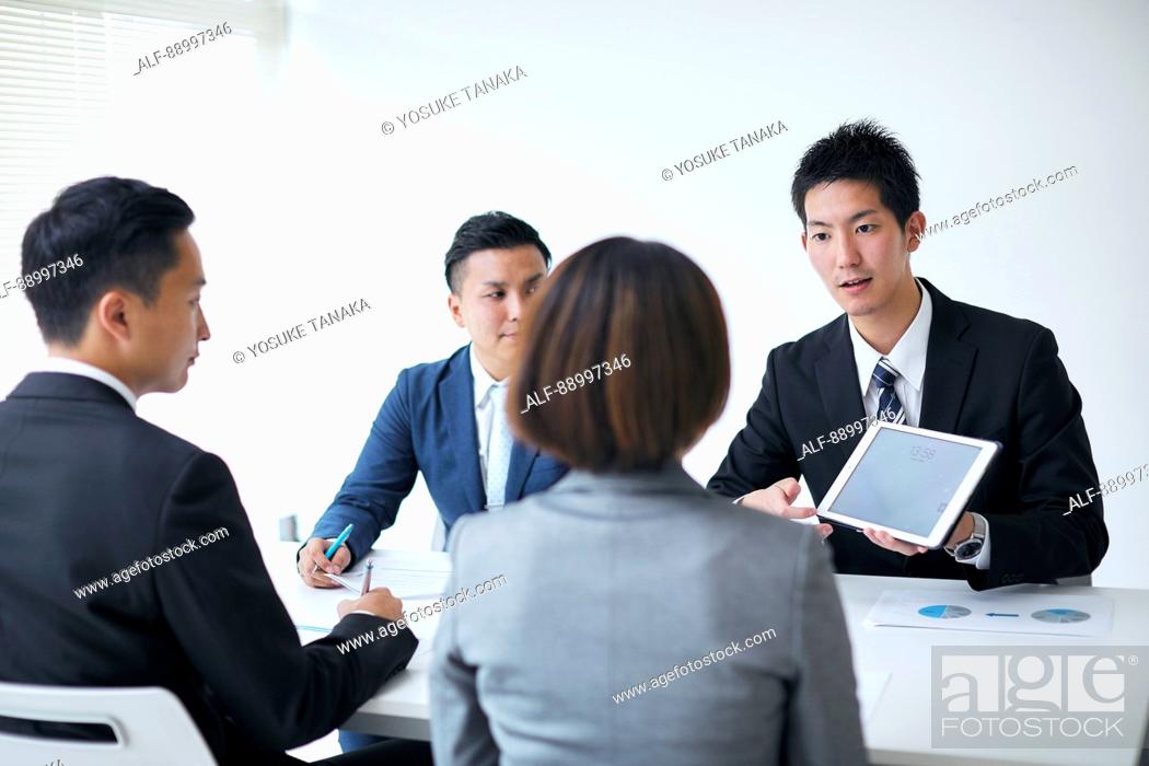 Stock Photo: Young Japanese businesspeople.