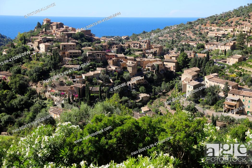 Stock Photo: 13 June 2020, Spain, Deia: View of the village with many German inhabitants or owners of second homes in Mallorca. The Balearic Islands.