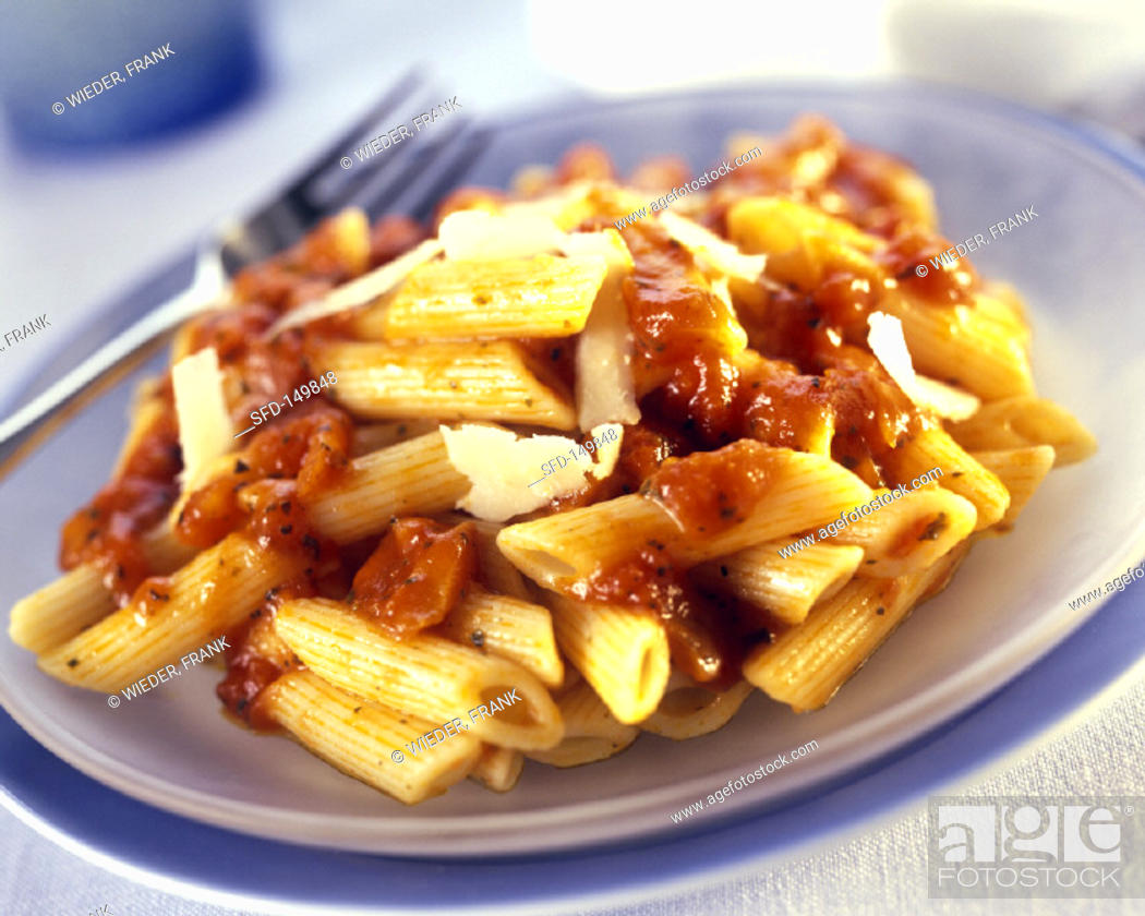 Stock Photo: Penne with Sauce and Parmesan.