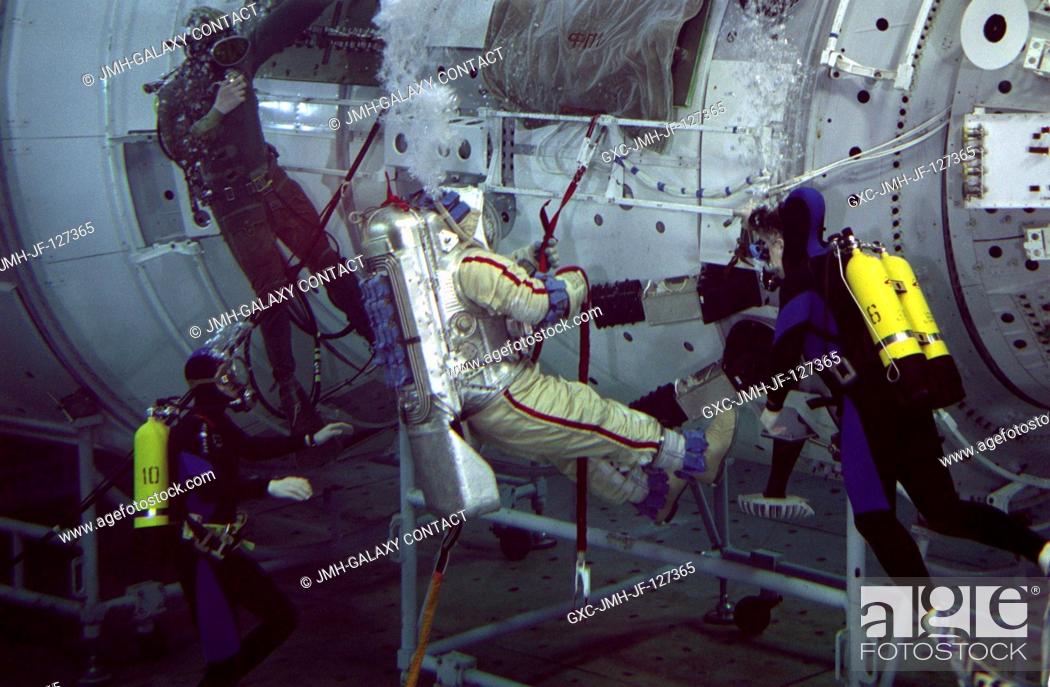 Stock Photo: Astronaut William Shepherd, ISS Expedition 1 commander, rehearses an extravehicular activity (EVA) with a full scale training model of the Zvezda Service Module.