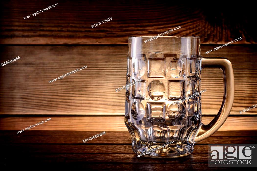 Empty beer mug on rustic wooden background with copy space, Stock Photo,  Picture And Low Budget Royalty Free Image. Pic. ESY-046806848 | agefotostock