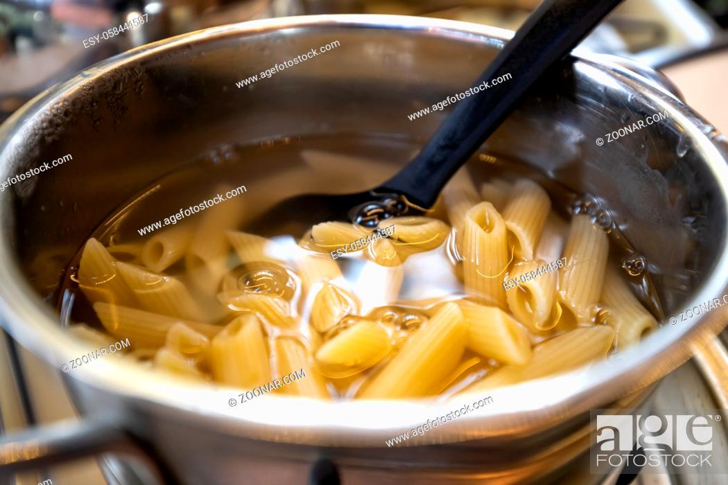 Stock Photo: Cooking fresh pasta in a pot.