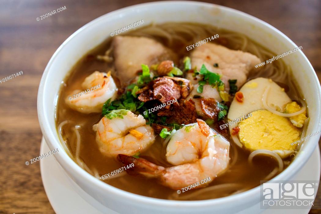 Stock Photo: Prawn and fish in indonesian spicy soup rice noodle called soto.