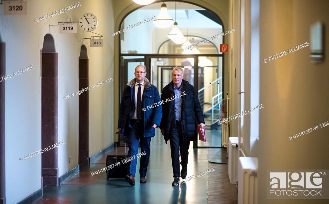 Stock Photo: 07 December 2018, Berlin: Hubertus Knabe (r), former director of the Hohenschönhausen memorial, comes together with his lawyer Martin Römermann to the hearing.