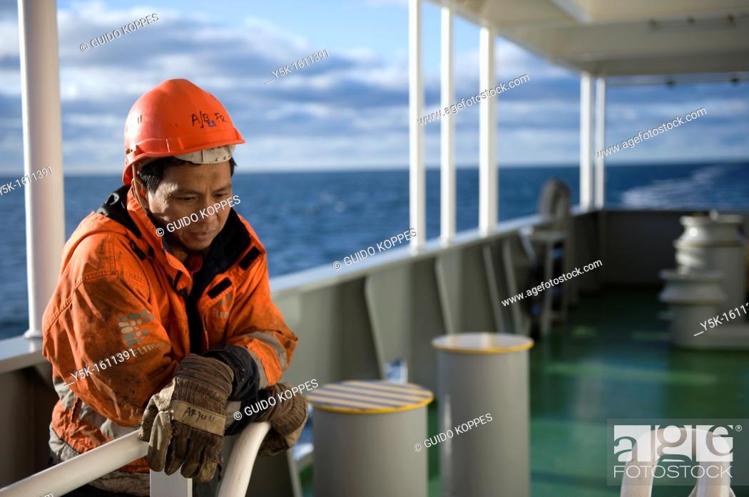 Stock Photo: Portrait of an Indonesian seaman or sailor on the container-vessel MV Flintercape, during a journey from Rotterdam, Netherlands, to Sundsvall, Sweden.