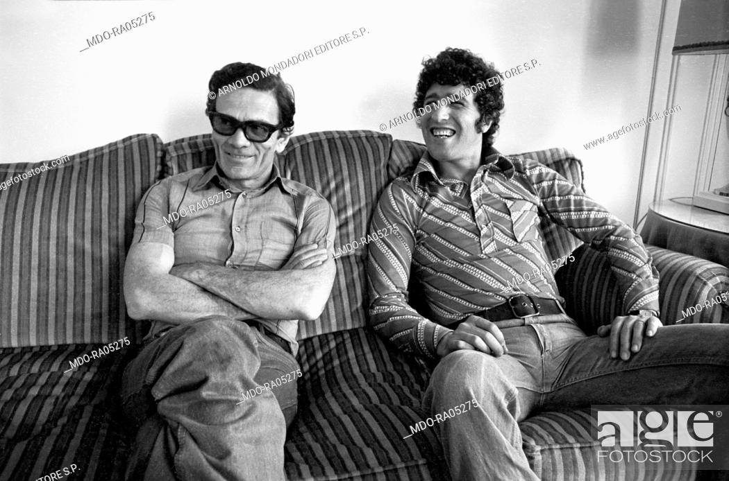 Stock Photo: Italian director and writer Pier Paolo Pasolini posing with Italian actor Ninetto Davoli (Giovanni Davoli). Cannes, 1970.