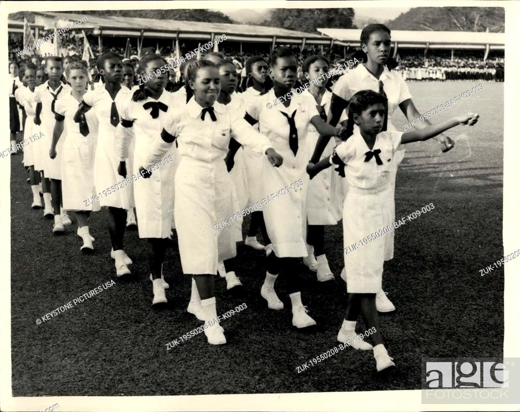 Stock Photo: Feb. 08, 1955 - Children walk into the Arena at Port of Spain Park for rally in honor of Princess Margaret. Photo shows proudly swinging their arms native.