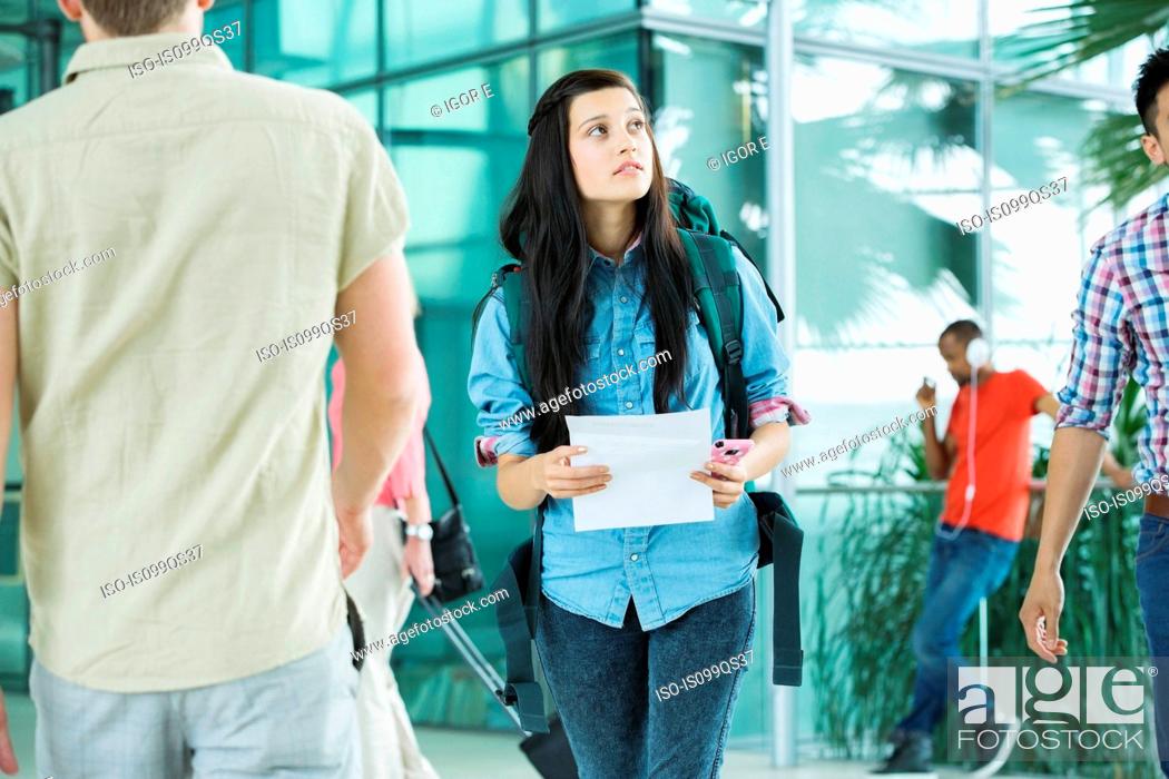 Stock Photo: Young female backpacker in airport.