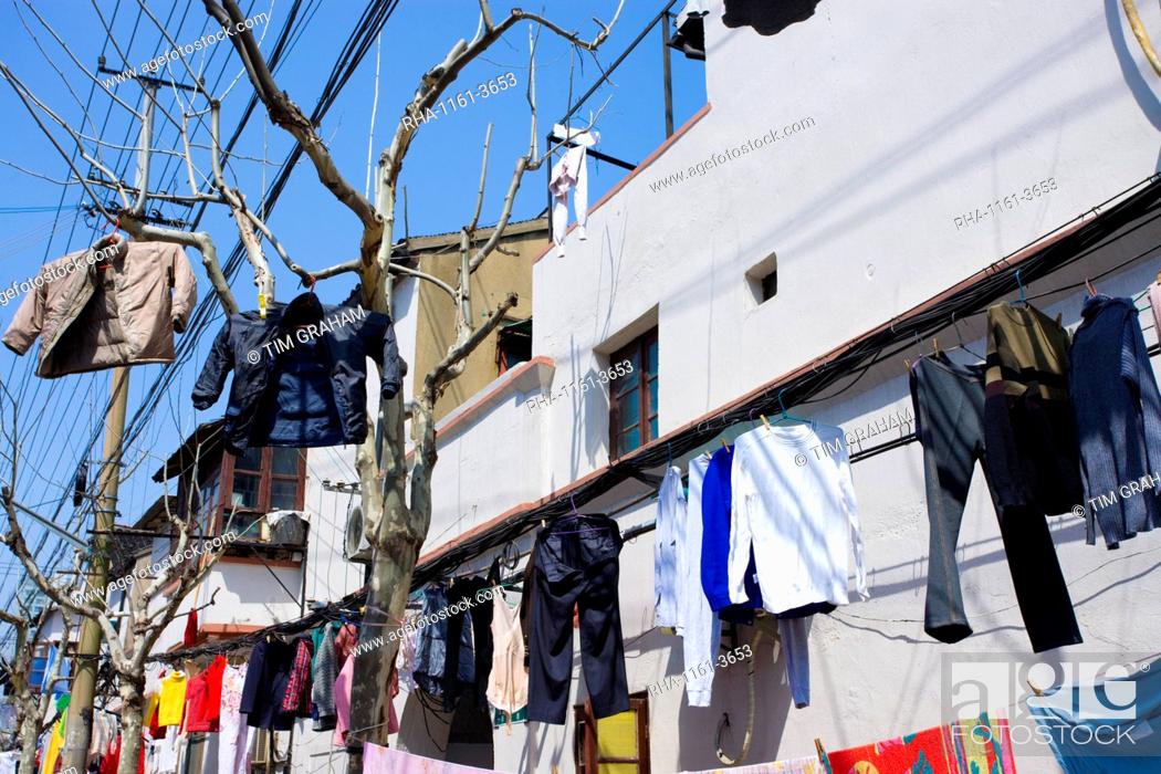 Stock Photo: Laundry hanging out to dry in Zi Zhong Road, the old French Concession Quarter of Shanghai, China.