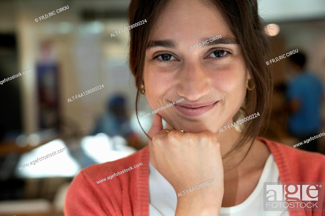 Stock Photo: Portrait of smiling young woman.