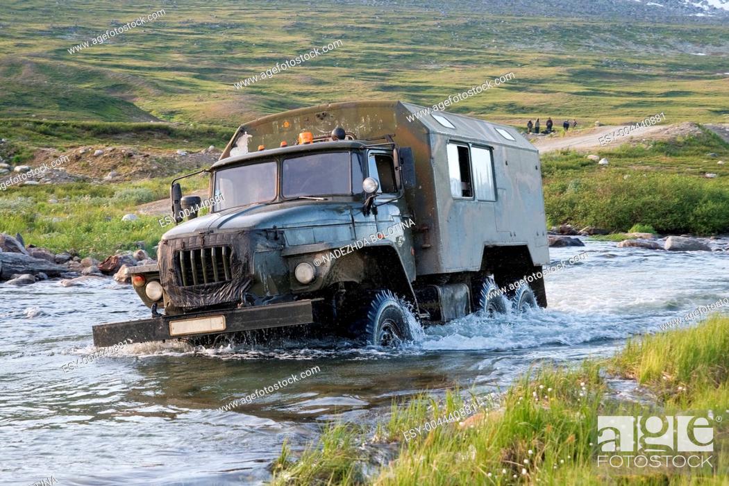 Stock Photo: Truck crossing a river.
