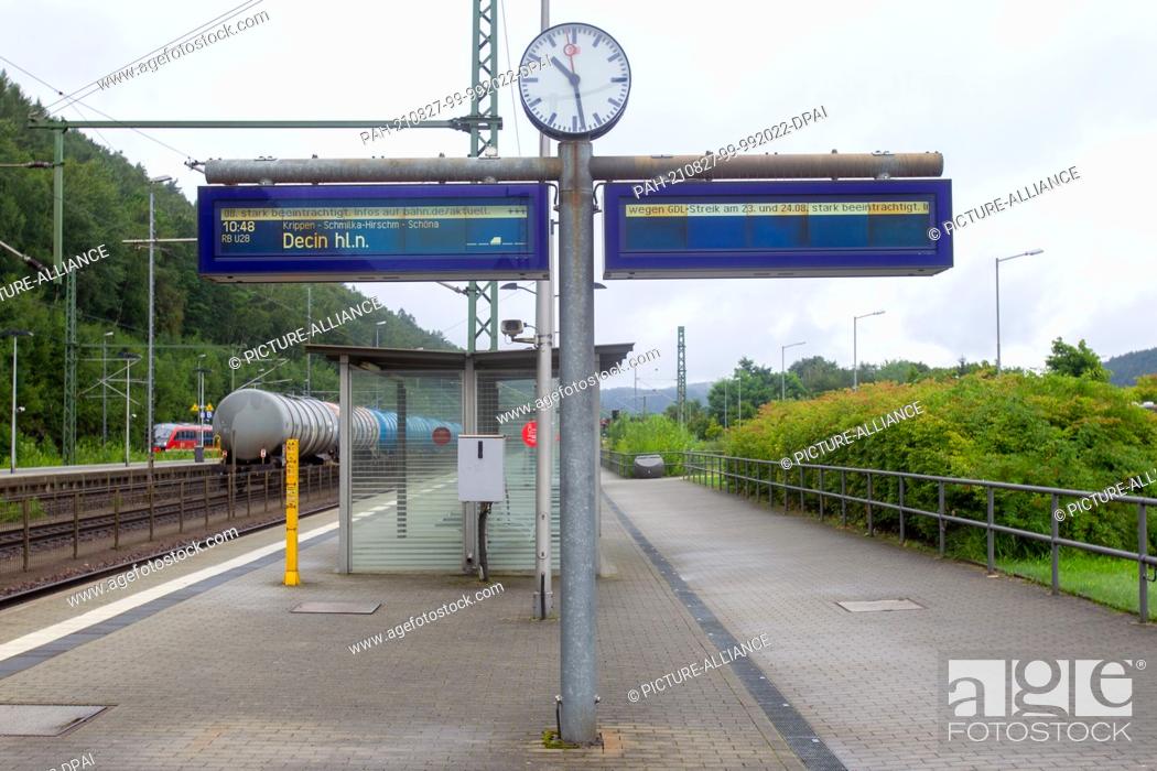 Stock Photo: 23 August 2021, Saxony, Bad Schandau: Strike in the passenger traffic of the DB AG. There are no people on the platform at Bad Schandau station.