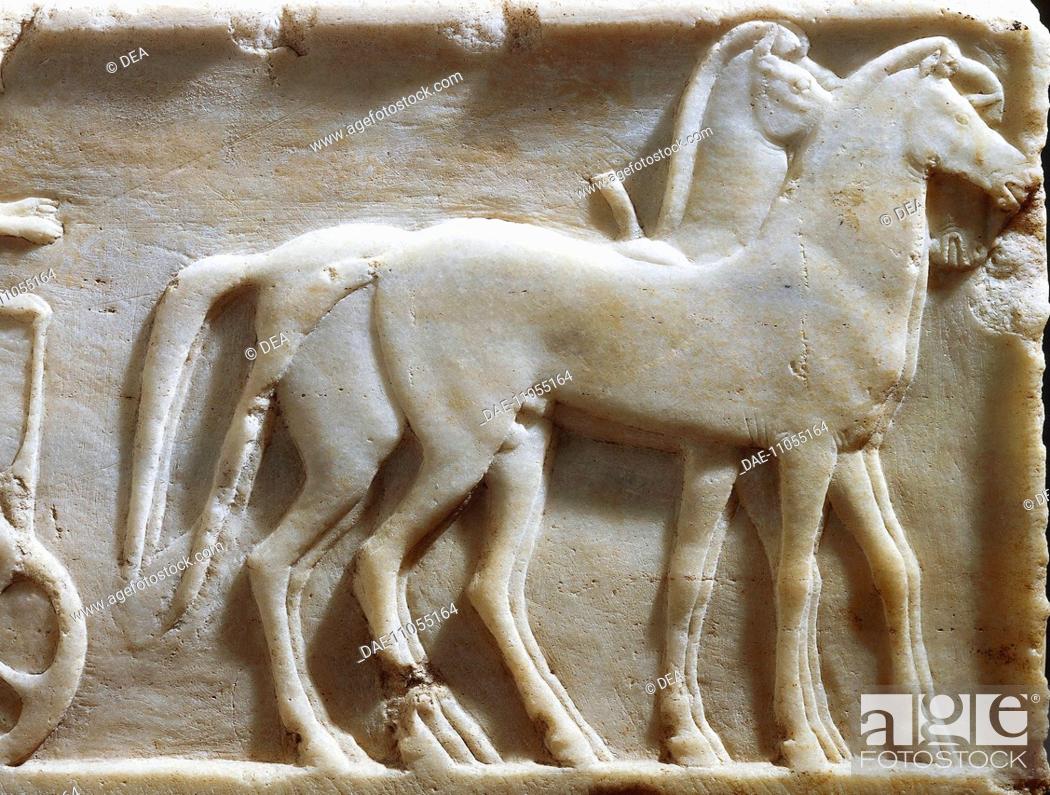 Stock Photo: Greek civilization, 5th century b.C. Plinth of kouros statue depicting Hoplites and a horse-drawn chariot, circa 490 b.C. Detail: horses.