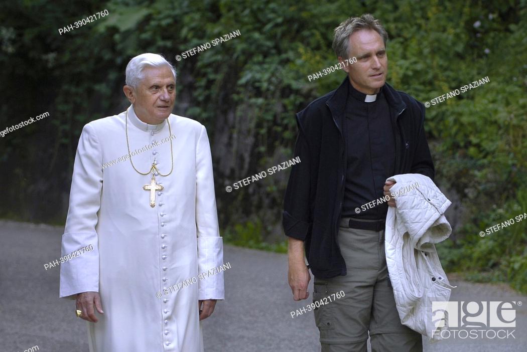 Stock Photo: Monsignor Georg Gaenswein. photo: Pope Benedict XVI walk on the banks of a river of mountain while recitation of the Rosary.