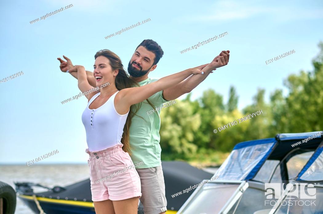 Stock Photo: A boat trip. A happy couple looking enjoyed while having a boat trip.