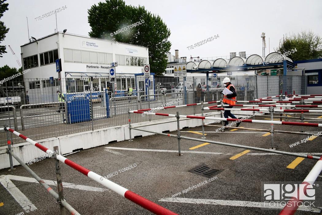 Stock Photo: Armored reopening at the Fincantieri in Marghera between thermal scanners and masks , Marghera, ITALY-20-04-2020.