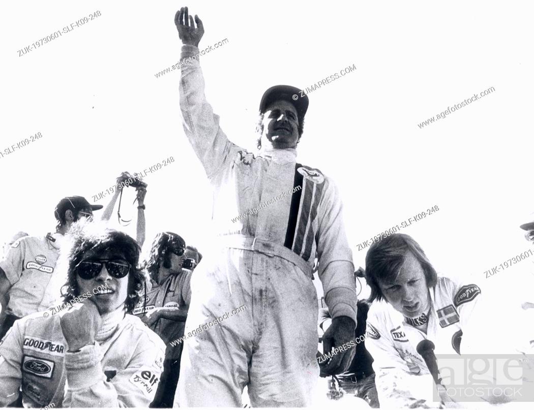 Stock Photo: Jun 01, 1973 - Smaland, Sweden - DENNY HULME raising his hand after he won the Swedish Grand Prix in Anderstorp. On his left is third place winner FRANCOIS.