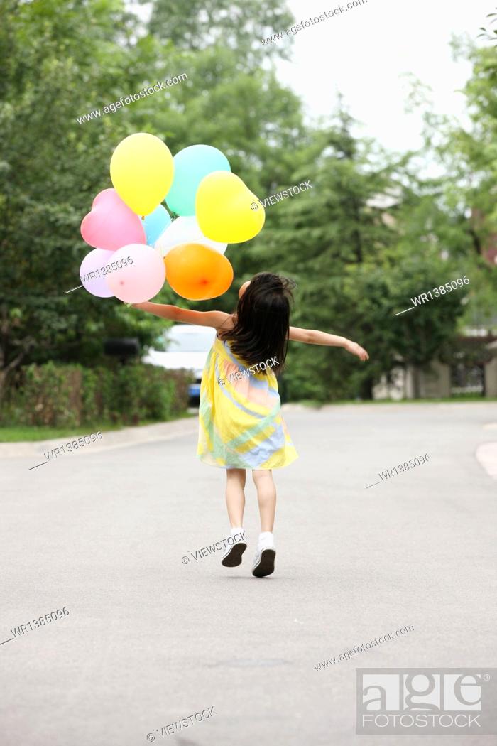 George Eliot verlichten Artefact Little girl holding balloons play, Stock Photo, Picture And Royalty Free  Image. Pic. WR1385096 | agefotostock