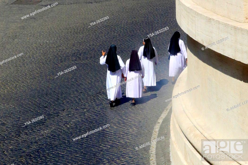 Stock Photo: Vatican. Four nuns walking in Vatican City.